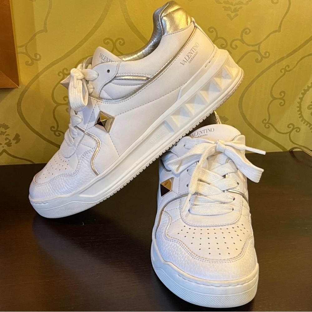 Valentino Garavani White Leather Rockstud Sneakers with Gold Accents